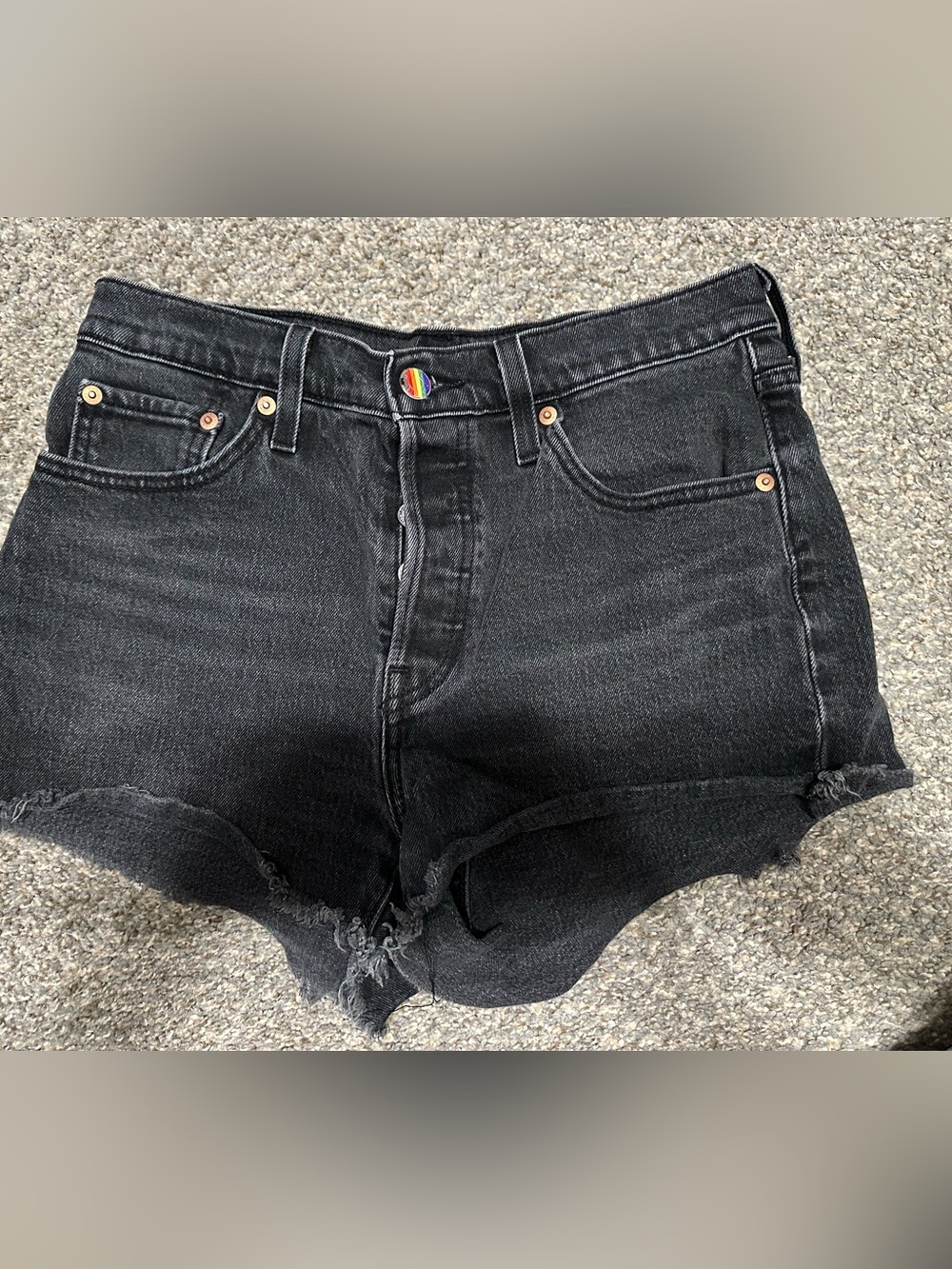 Levi’s 501 black cutoff denim shorts with custom rainbow button - size 28